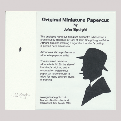 
        Front of silhouette, with man looking left, wearing a hat and smoking a sigarette. Long inscription starting, Original Miniature Papercut by John Speight...